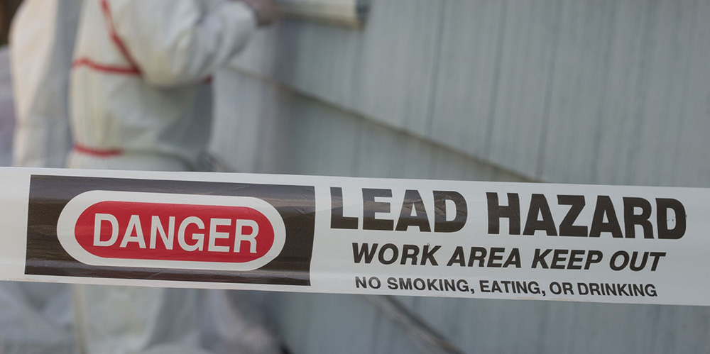 Danger lead Hazard with people testing the house